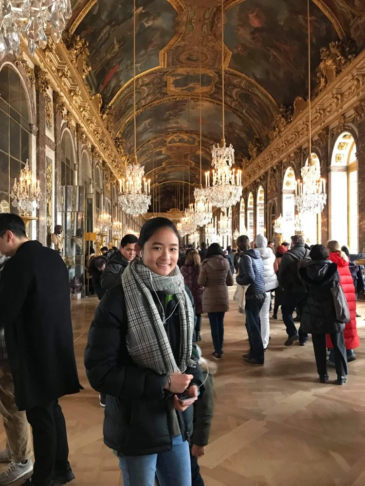 Exchange student visiting the Hall of Mirrors at the Palace of Versailles